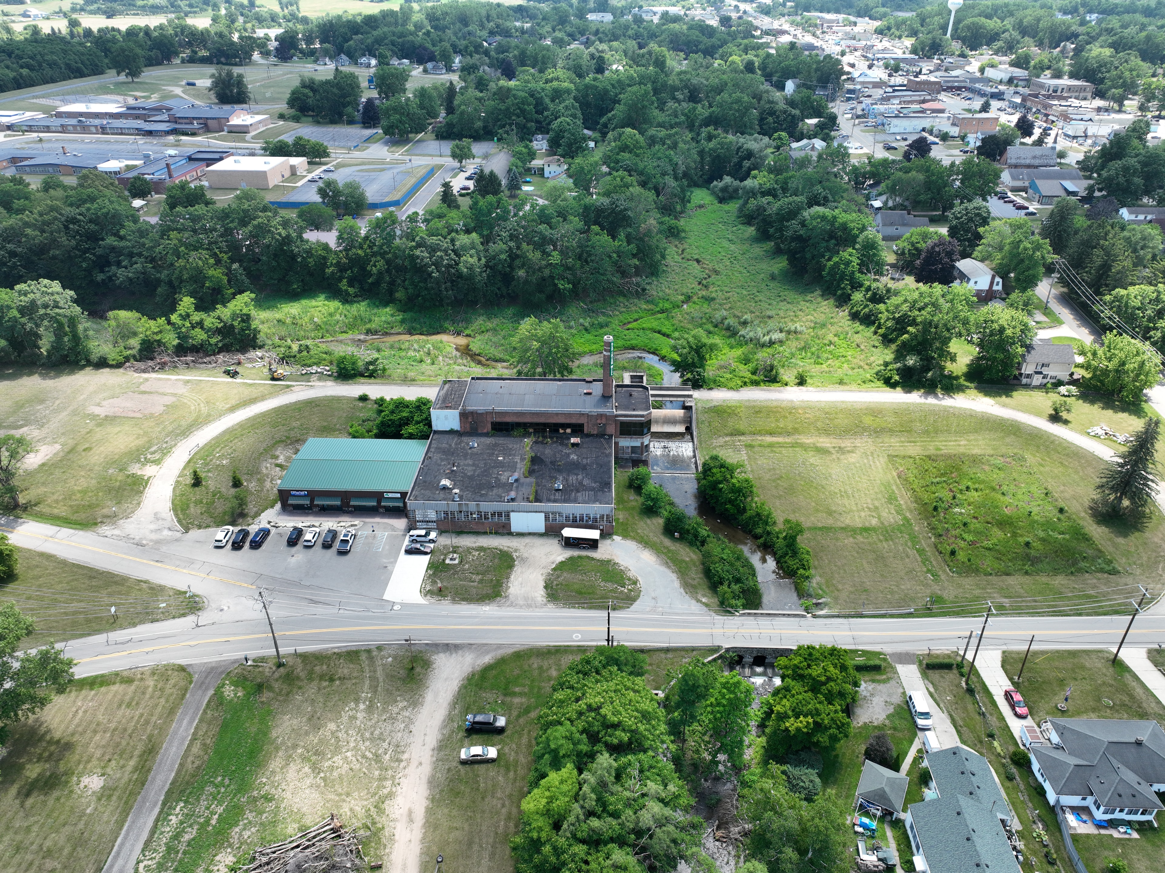 Aerial site overview — active excavation and stream restoration